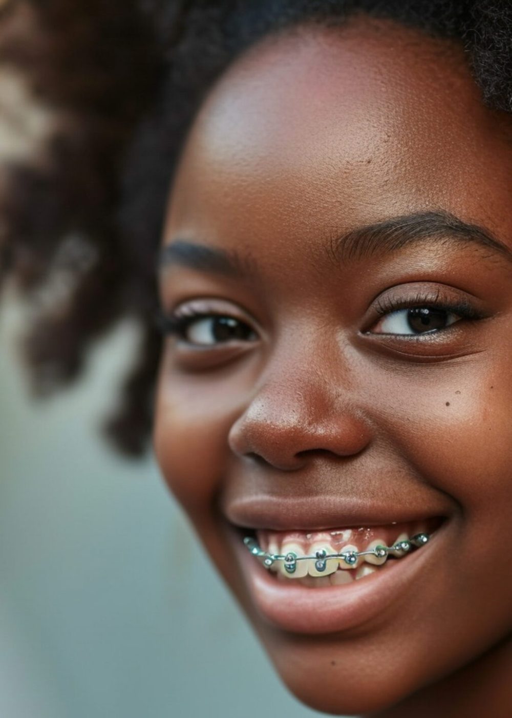a black girl with braces on her teeth smiling, mediun shot, hyper realistic photo --ar 16:9 --style raw --v 6 Job ID: 7eaaf1e3-c58c-44dc-8cdf-f5d14e29c96c